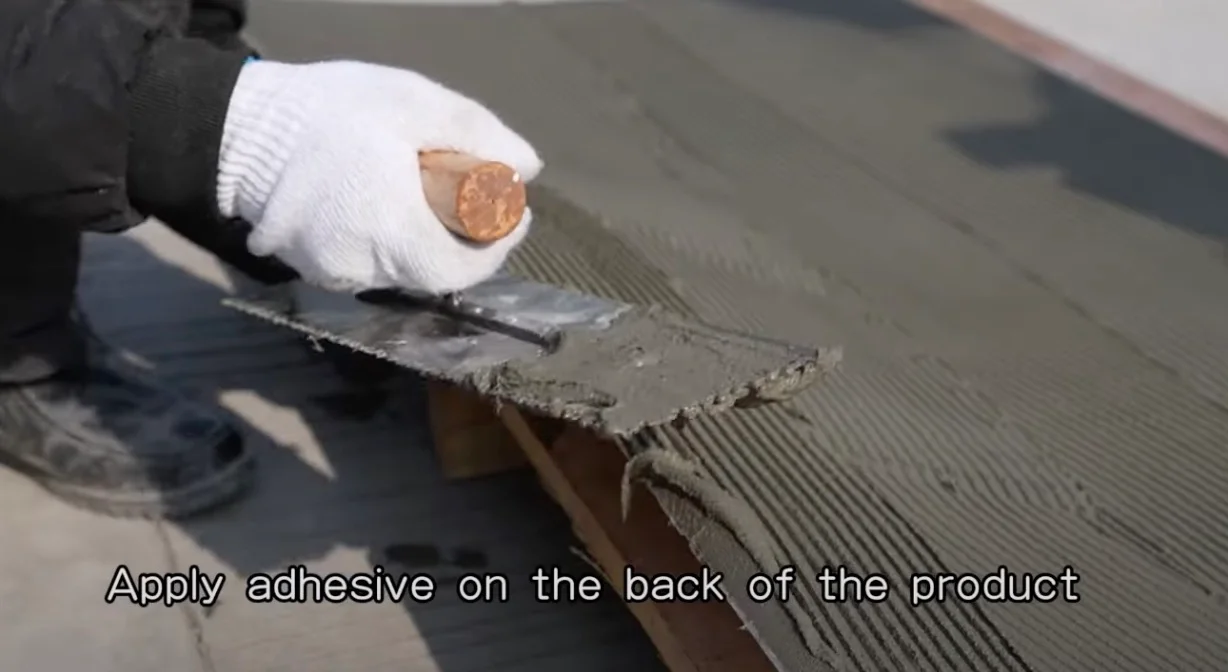 Step-by-step installation of lightweight flexible stone panels showing proper adhesive application technique